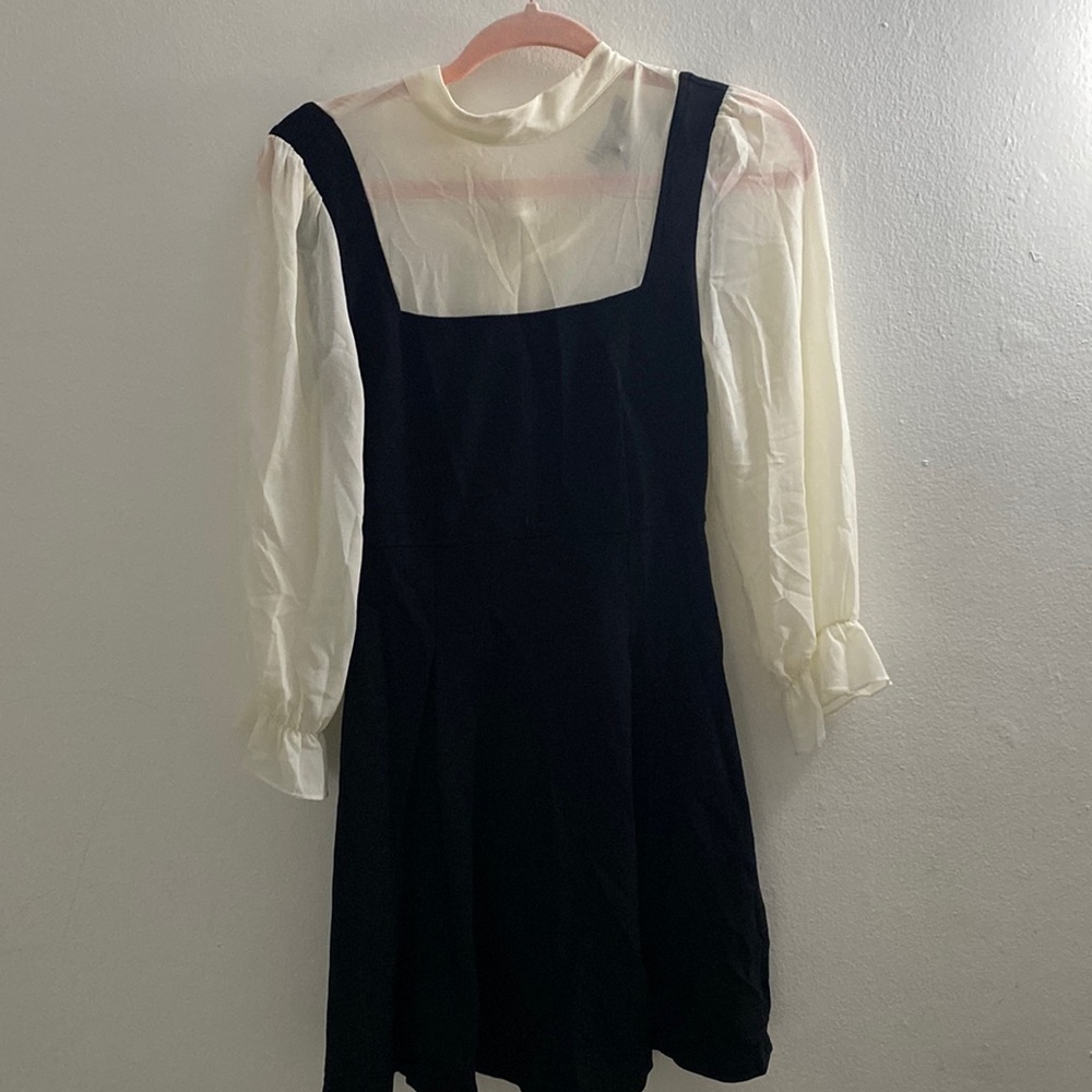 F21, little black dress w sheer, white, long-sleeved shirt. Cher Horowitz vibes